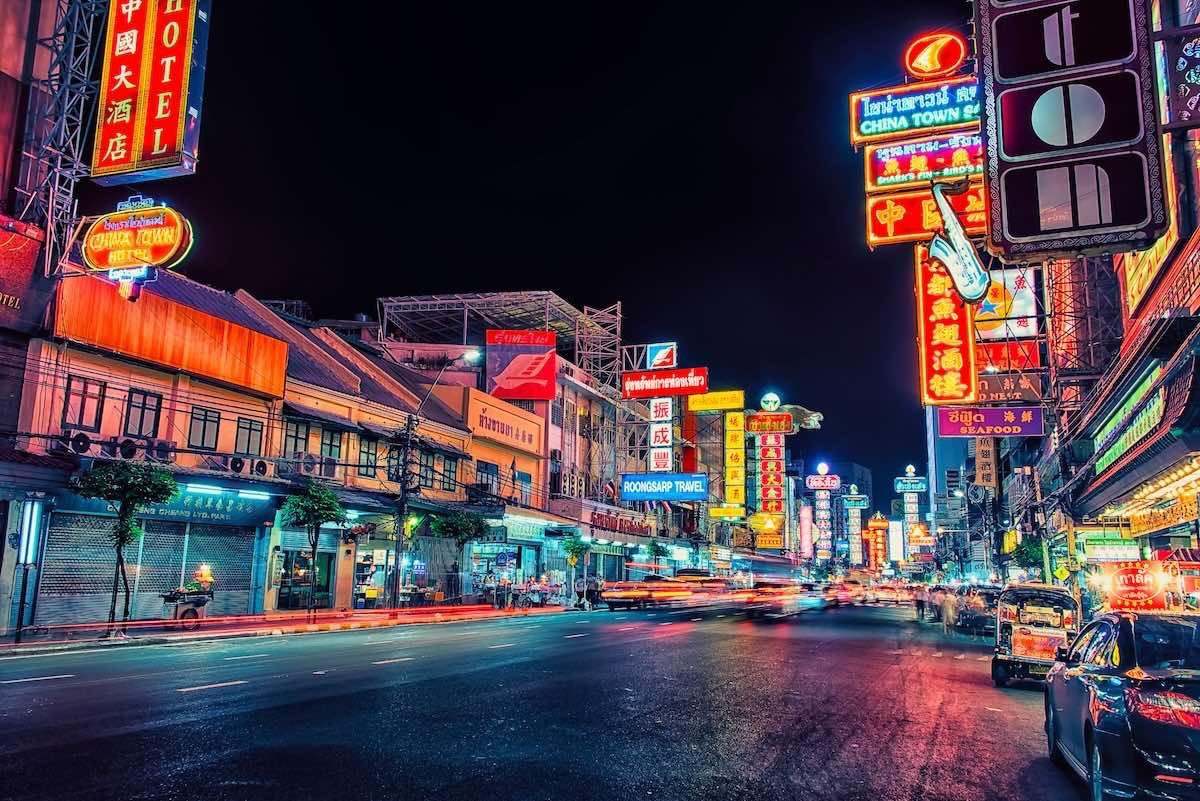 Neon-lit Chinatown street at dusk