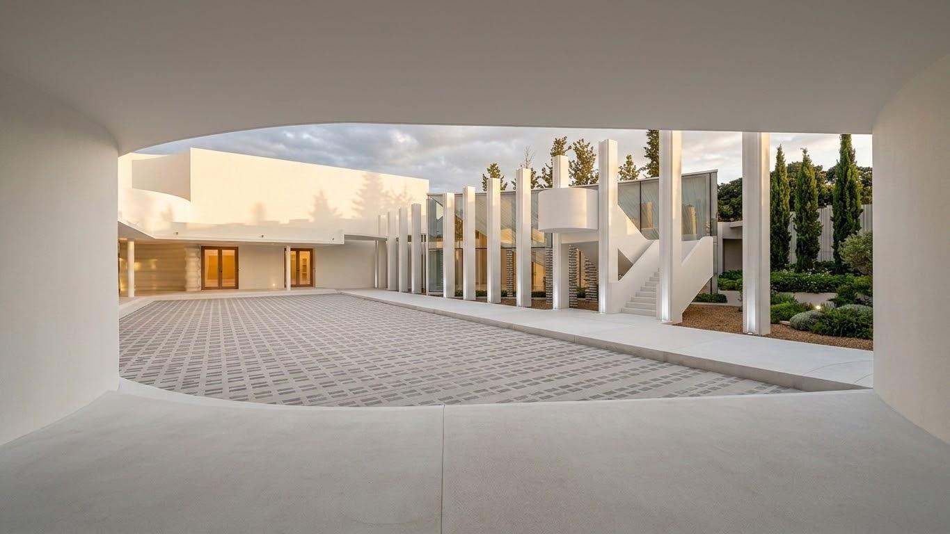 White minimalist gallery space with columns