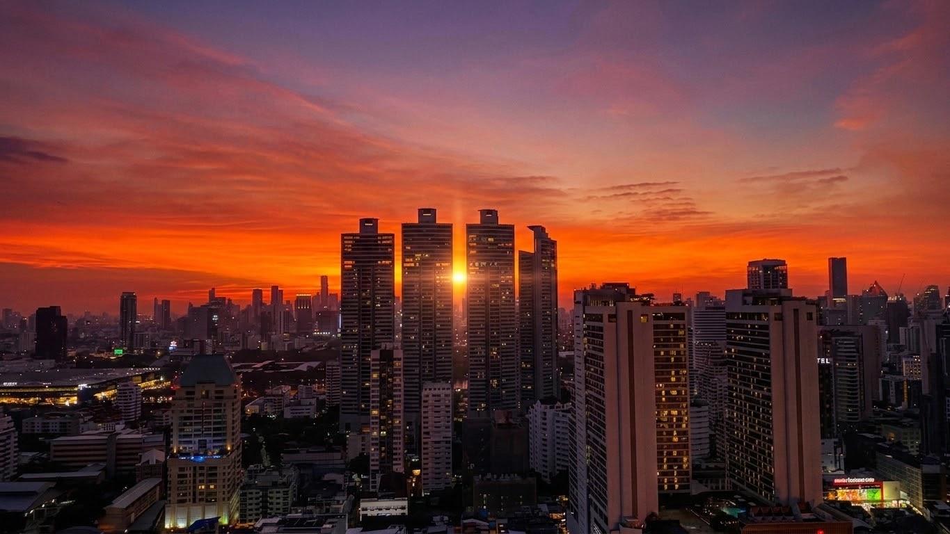 City skyline under a fiery sunset